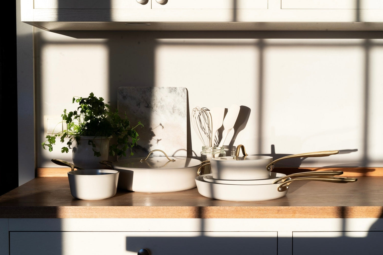 White ceramic coated pans in sunlight